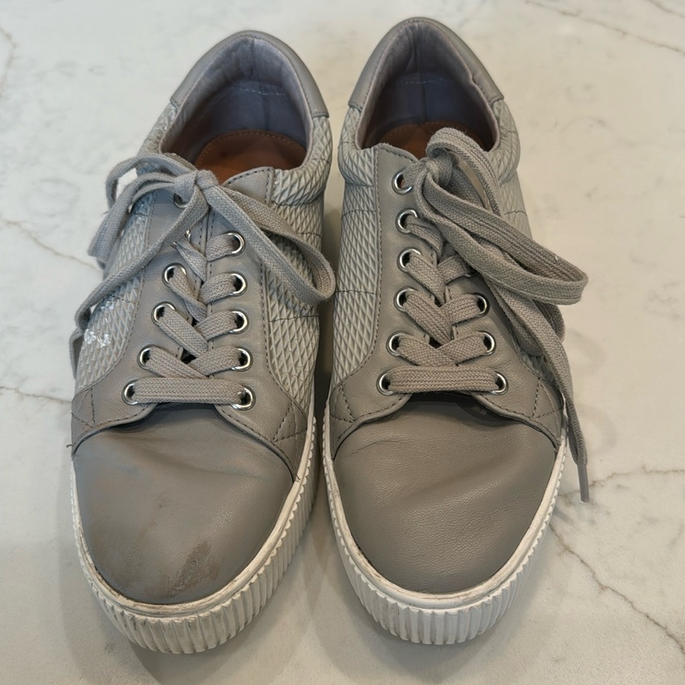 Halogen tennis shoe in size 8. Worn 2X. A little scuff on the right shoe.